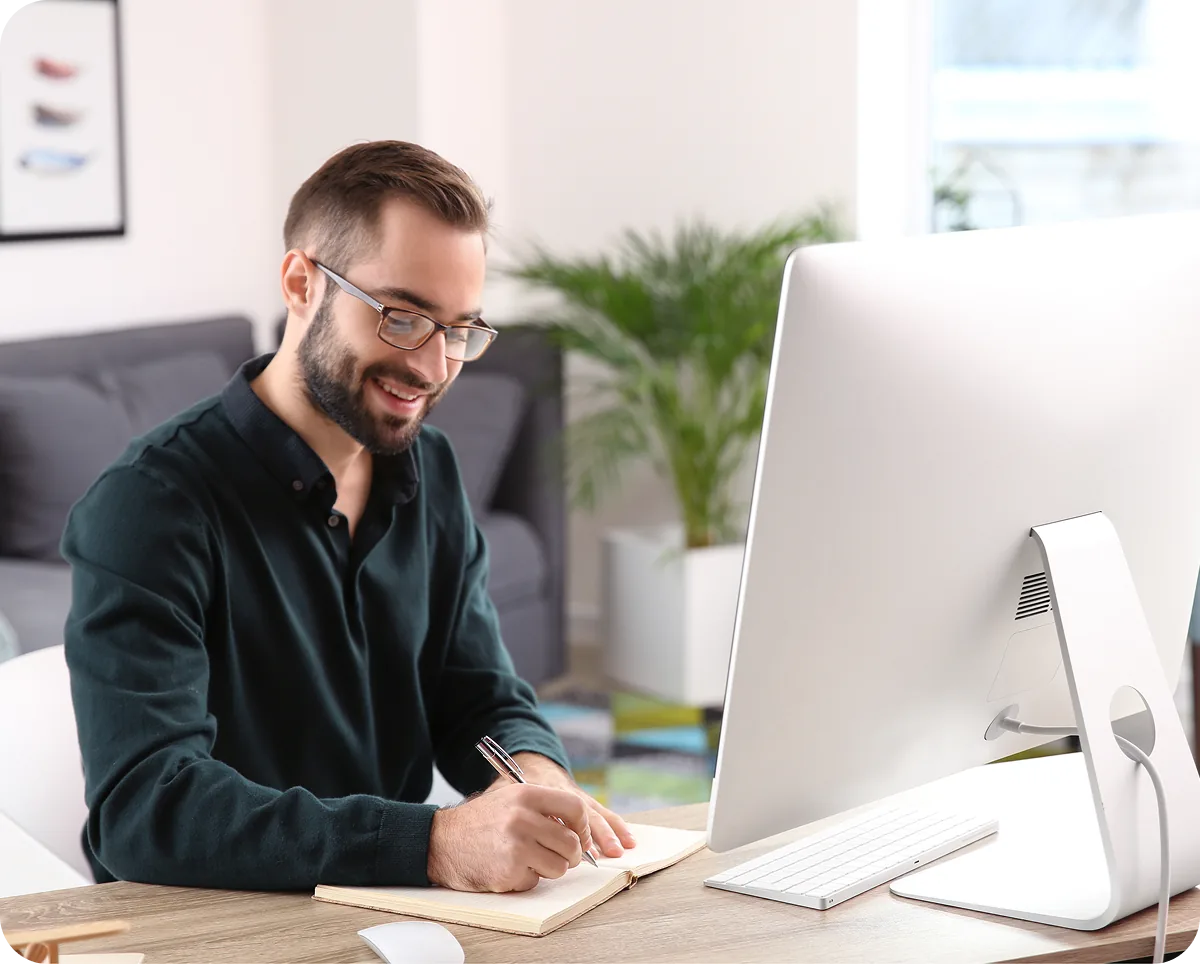 A commercial operator working at a desktop computer