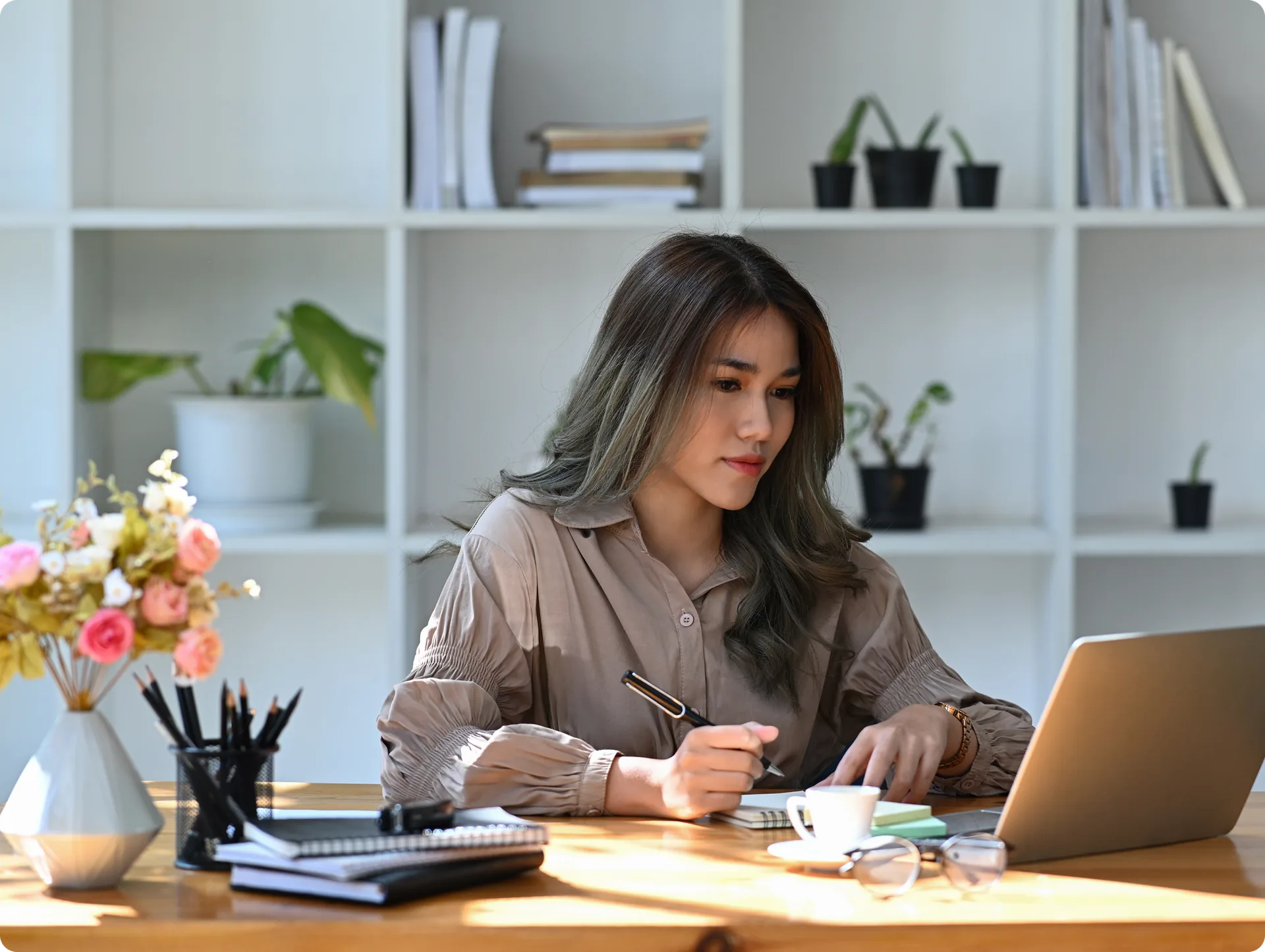 A systems lead working at a desk