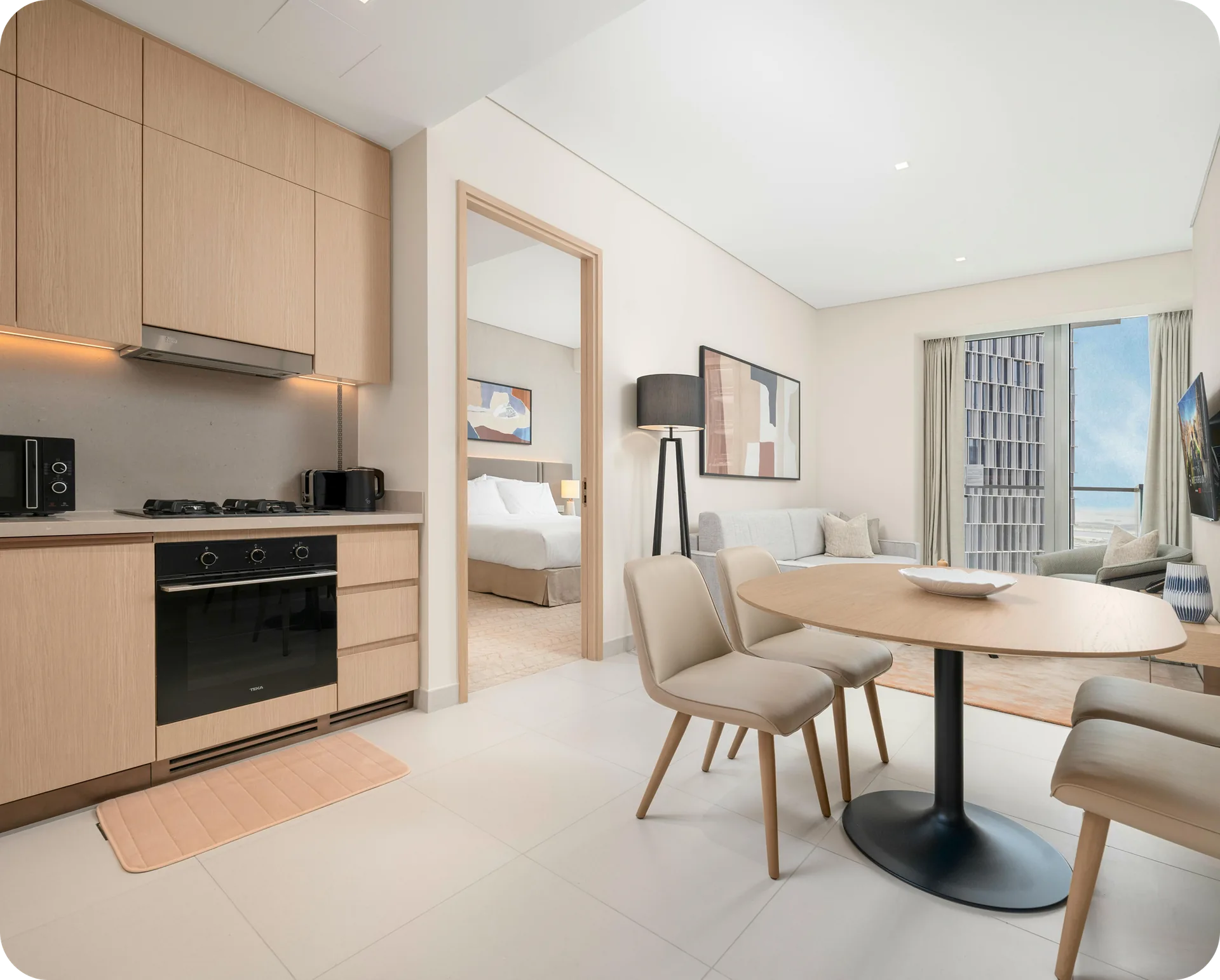 A serviced apartment with an open kitchen and dining area