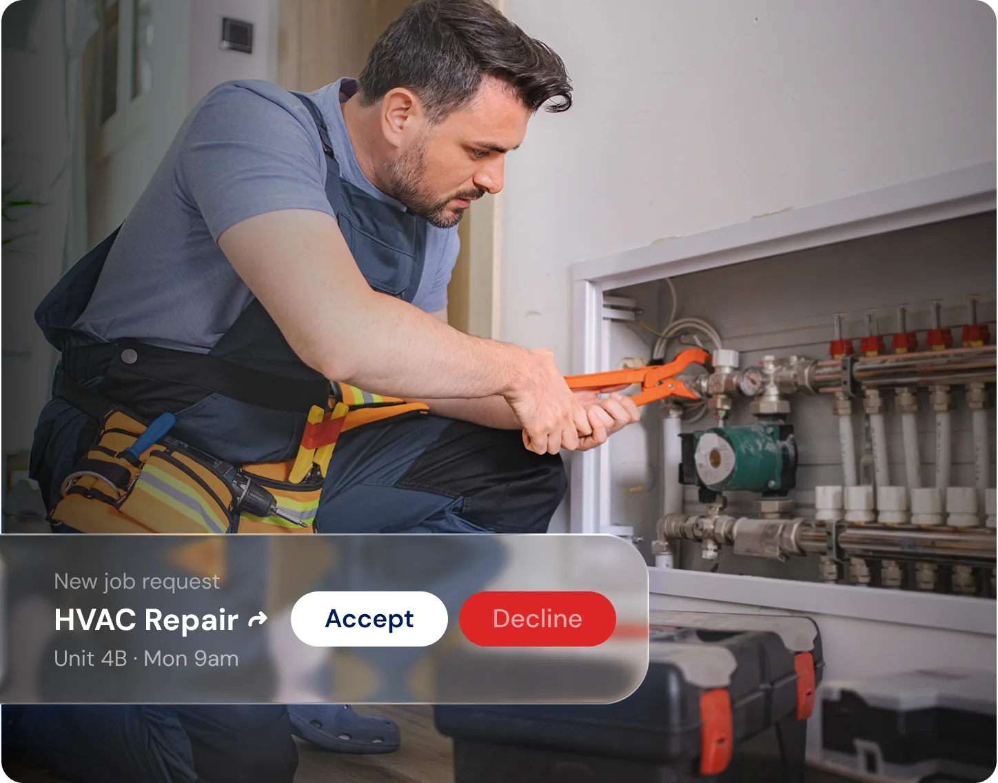A vendor repairing a boiler, beside a new job request to accept or decline