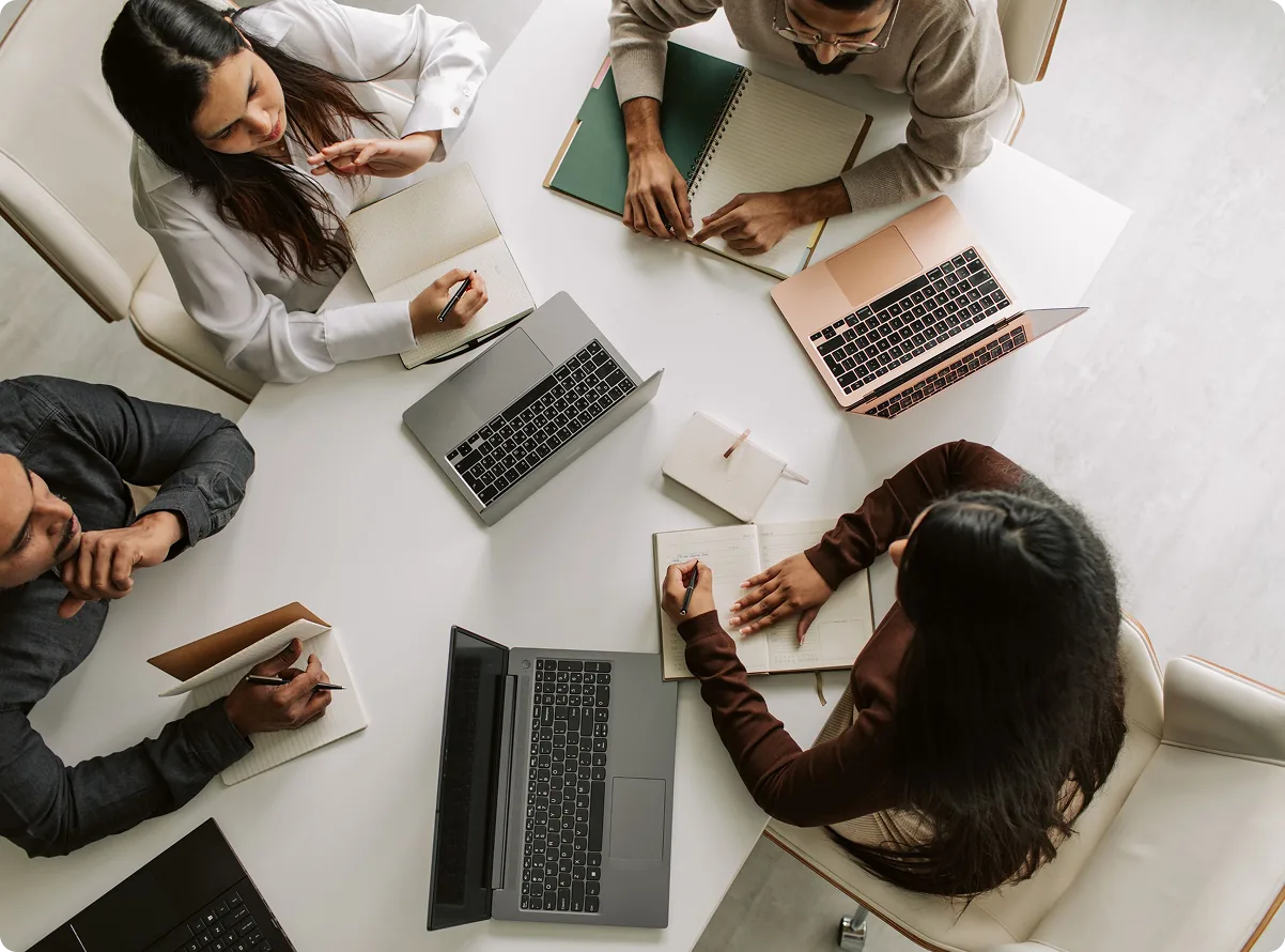 A team working through onboarding around a table