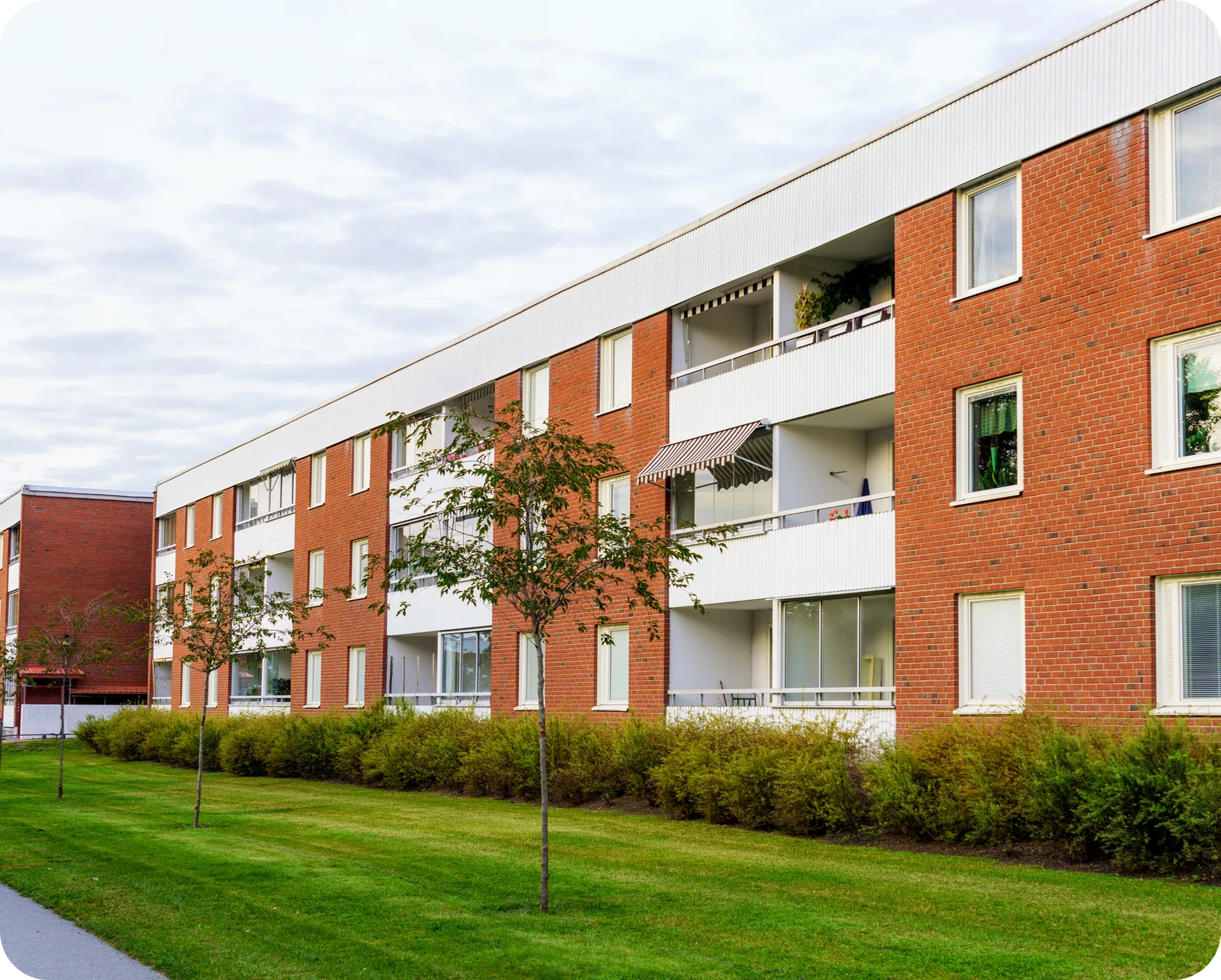 A red-brick student residence with balconies