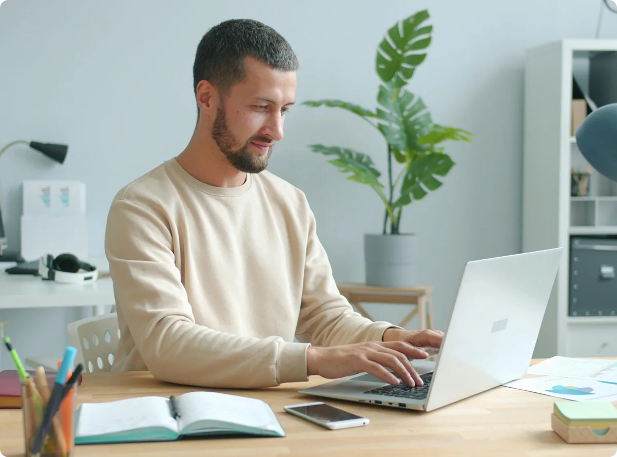 A landlord updating lease details on a laptop