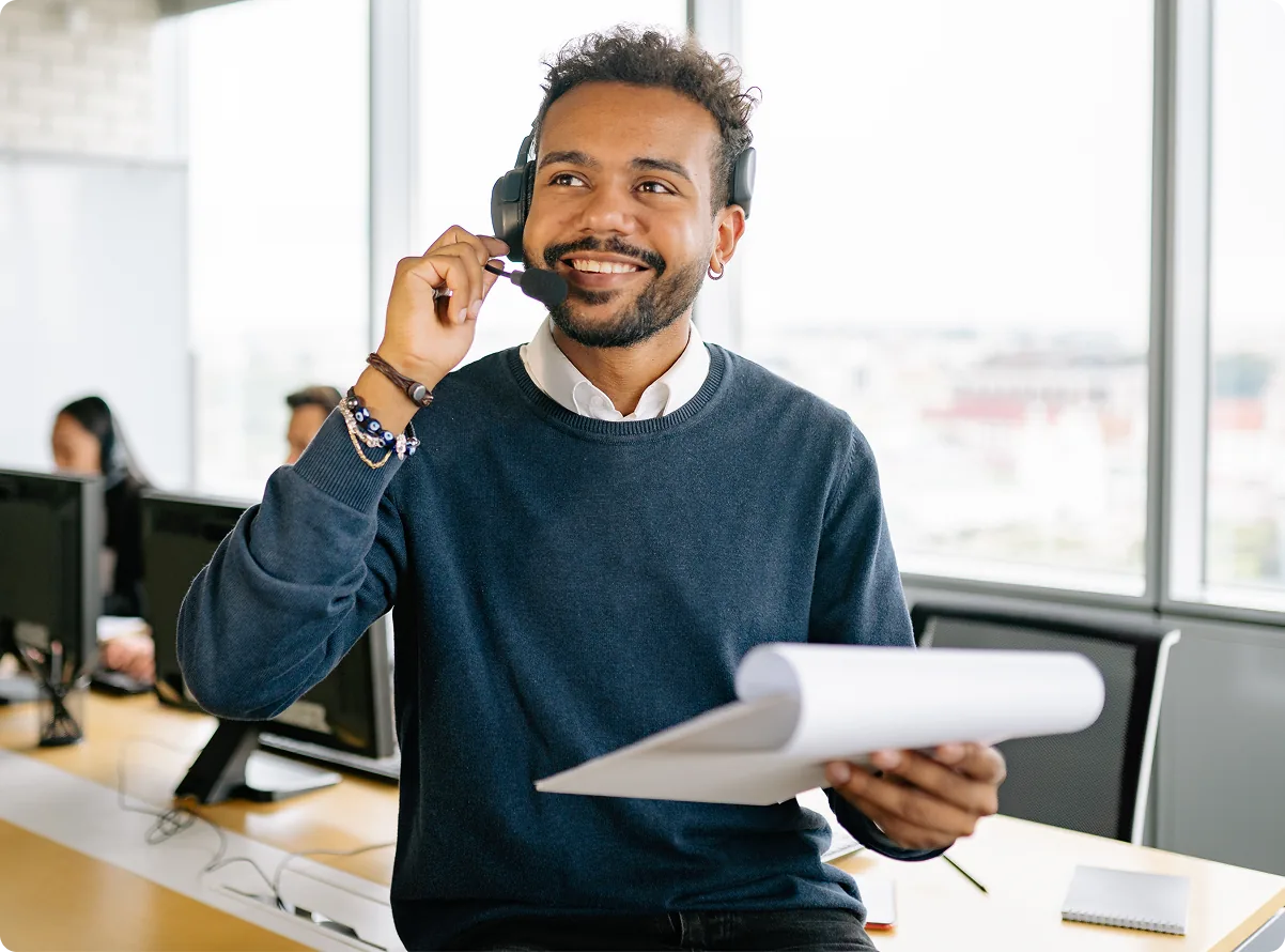 A property owner taking a call at a desk