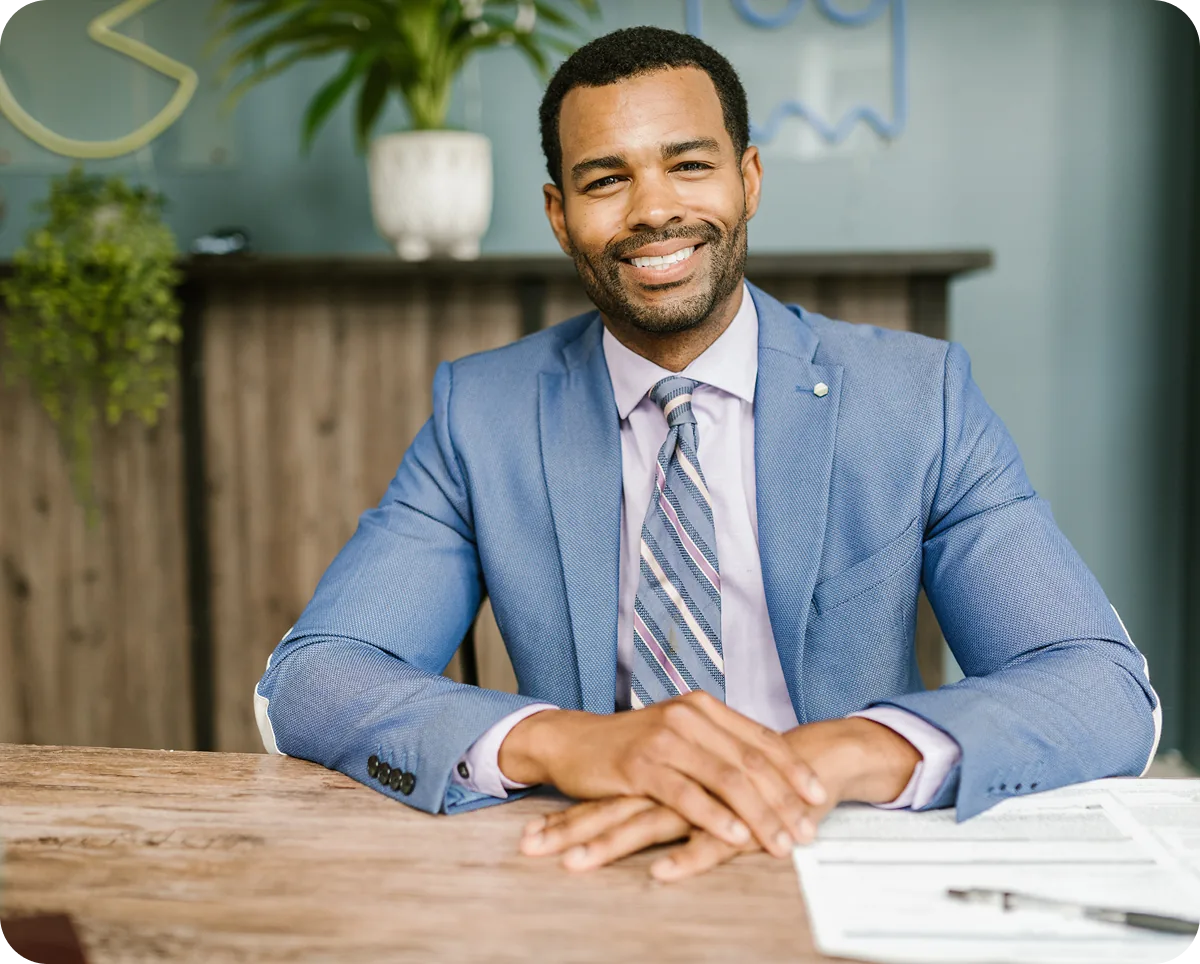 An independent landlord sitting at a desk