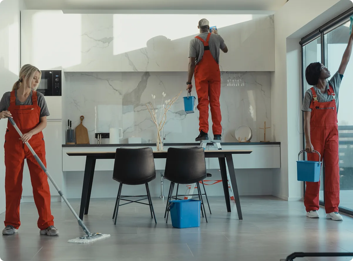 A cleaning crew at work in an open-plan home