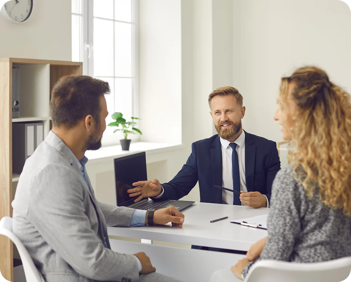 A property team meeting around a desk