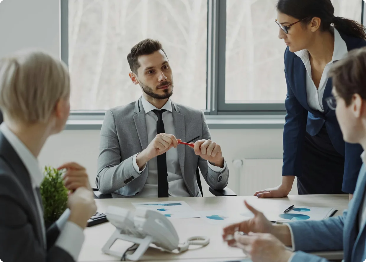 A team reviewing applications together in a meeting room