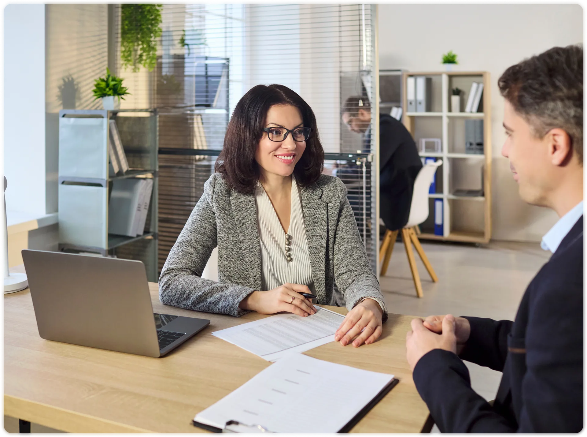 A leasing agent signing a lease with a prospective tenant