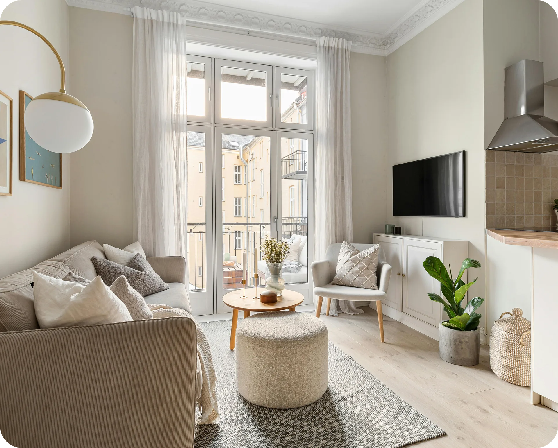 A bright residential living room with a balcony