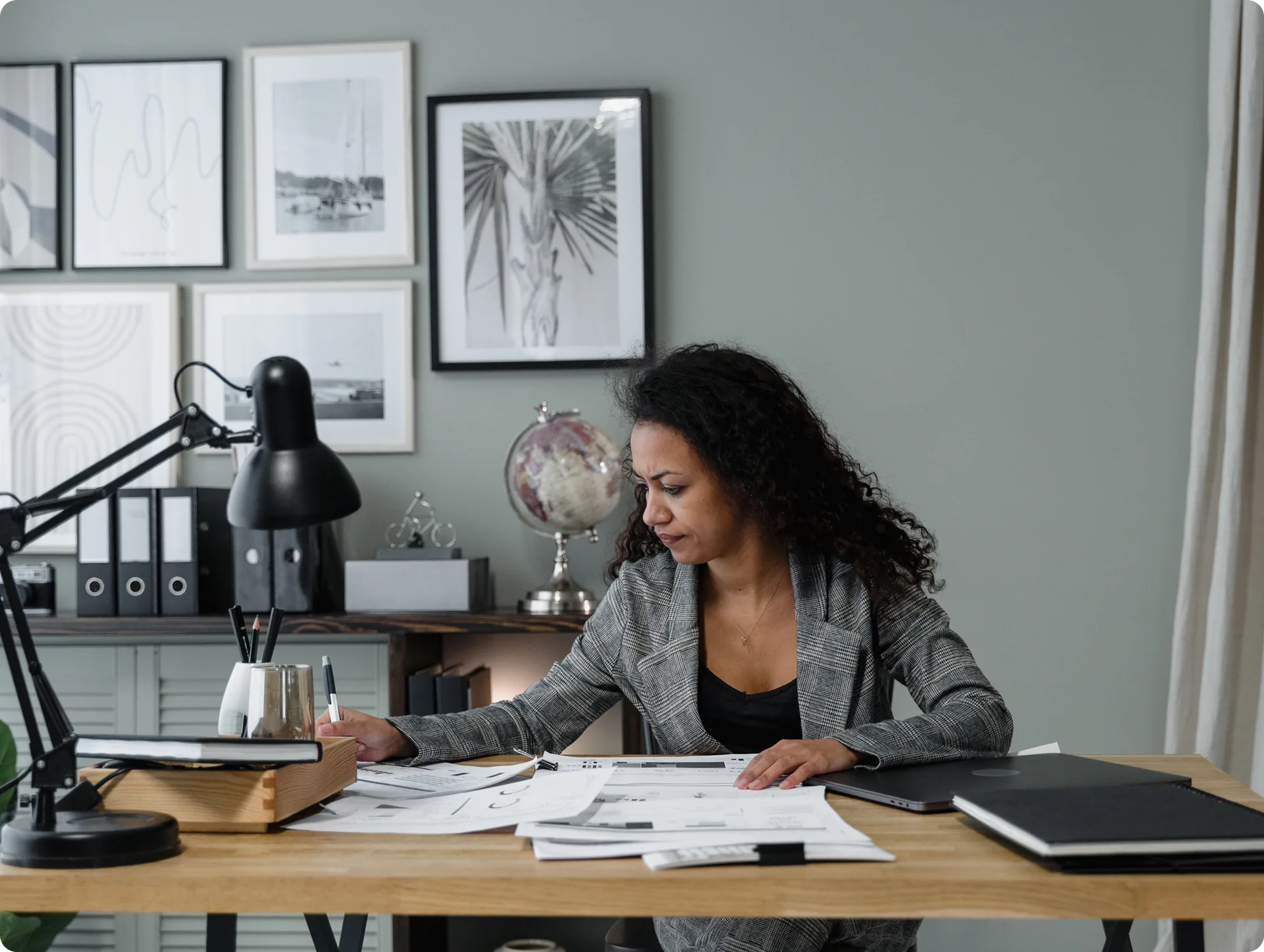 An operations manager working through paperwork at a desk